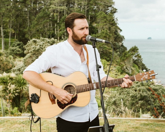 Wedding Musician singing and playing guitar