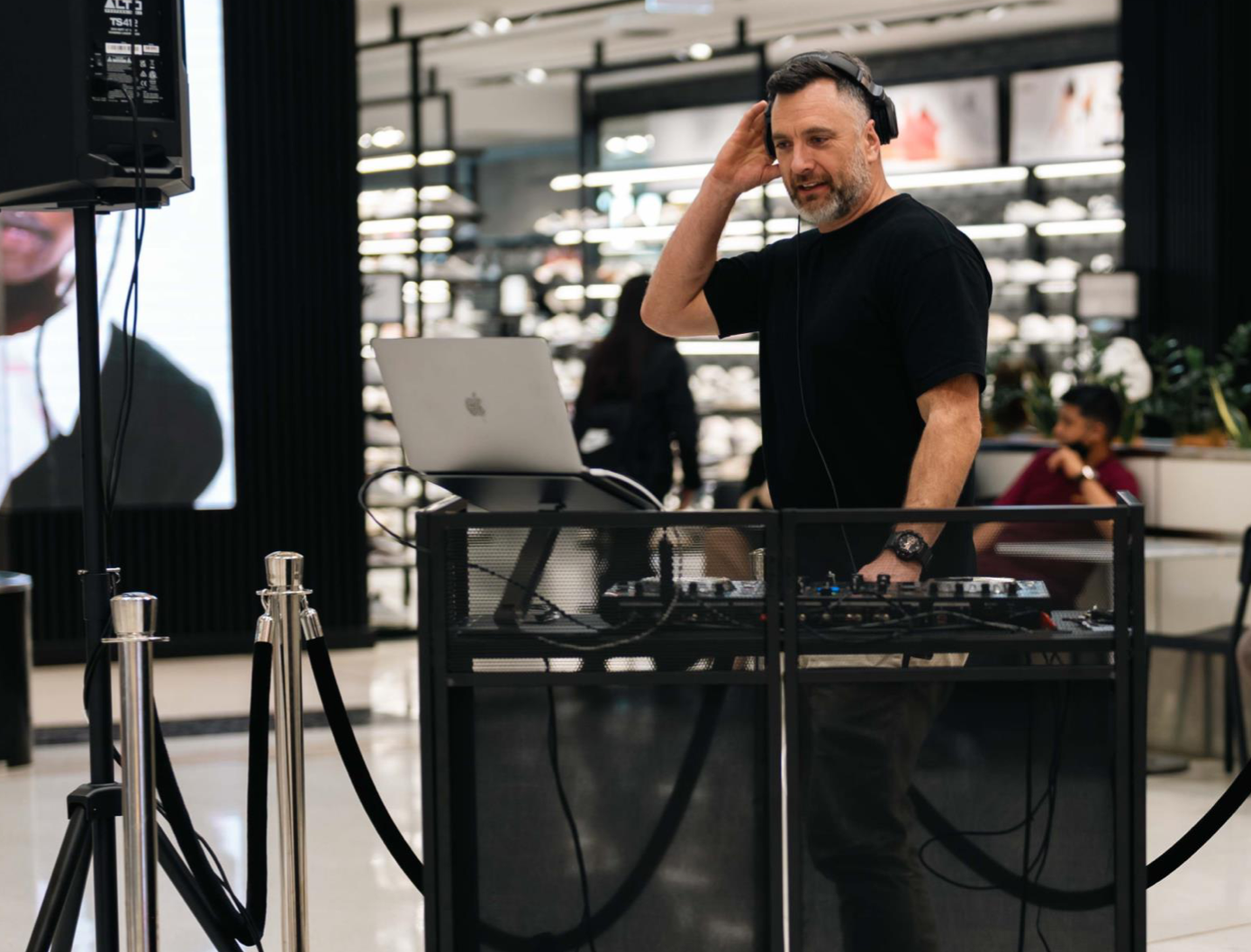 DJ Dylan performing at a retail event